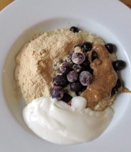 Baobab porridge with blueberries, almond butter and natural yoghurt