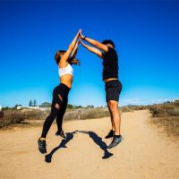 Sweat Together, Stay Together - 12 Workout Ideas Perfect For Couples Partner Jump Squat - High-Fives