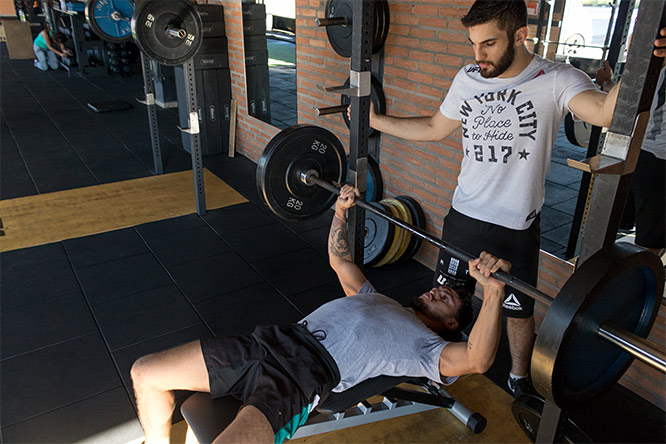 personal trainer helping